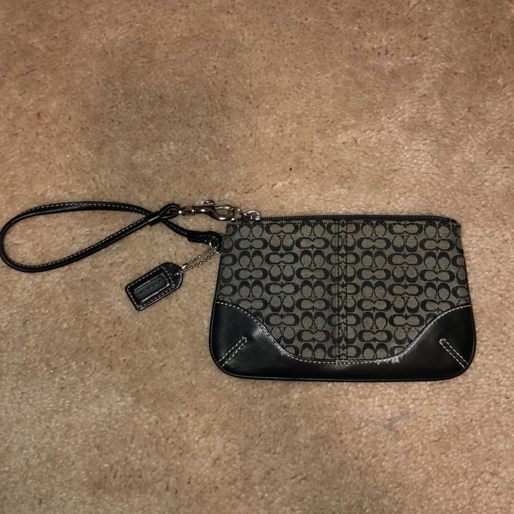 Black and grey Coach wristlet